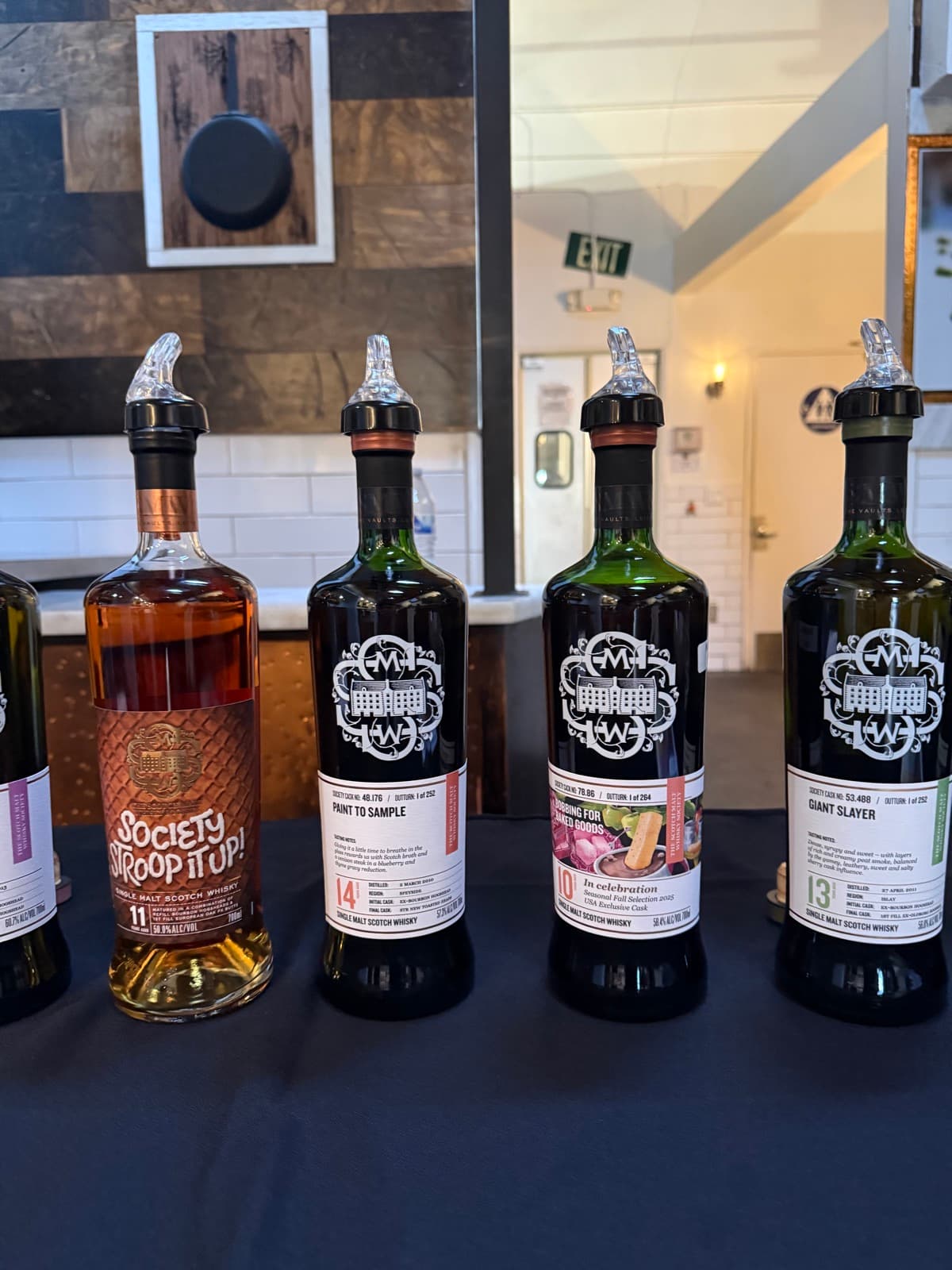SMWS bottles Stroop it Up, Paint to Sample, Giant Slayer and Hefty Peat Smoke on the tasting table